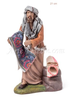 Pastor vendiendo alfombra