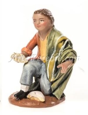 Niño arrodillado con pan