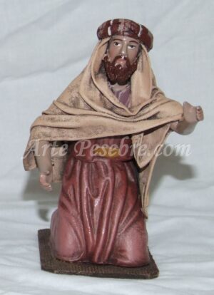 Pastor arrodillado con barba