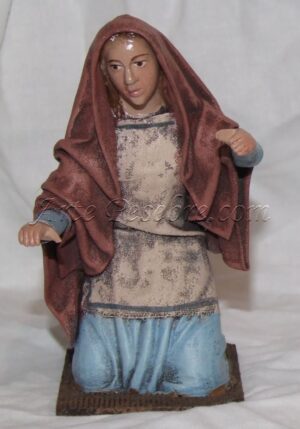 Pastora joven arrodillada