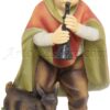 Niño músico con cabra