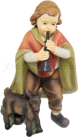 Niño músico con cabra