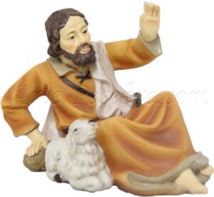 Pastor tumbado con cordero