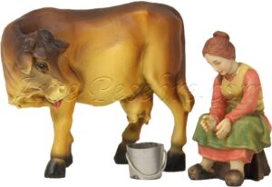 Pastora ordeñando vaca