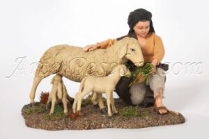 Niño con oveja y corderos