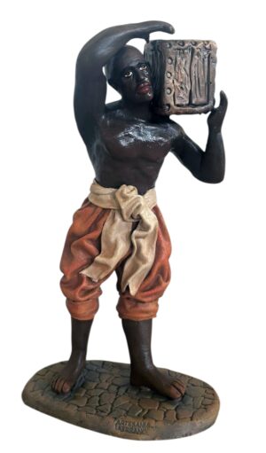 Esclavo con cofre al hombro