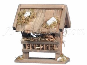 Comedero de madera con paja